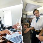 First-class pretenders are trying to grab free drinks with ‘seat-squatter’ hack