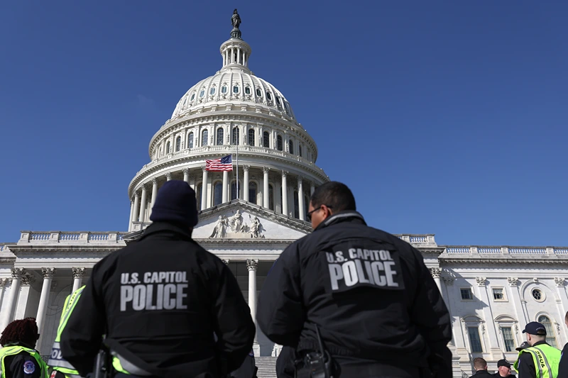 F U.S. Capitol police officers gather on the east front plaza of the Capitol on February 28, 2022 in Washington, DC. Security has been heightened and fencing was erected around the U.S. Capitol ahead of U.S. President Joe Biden
