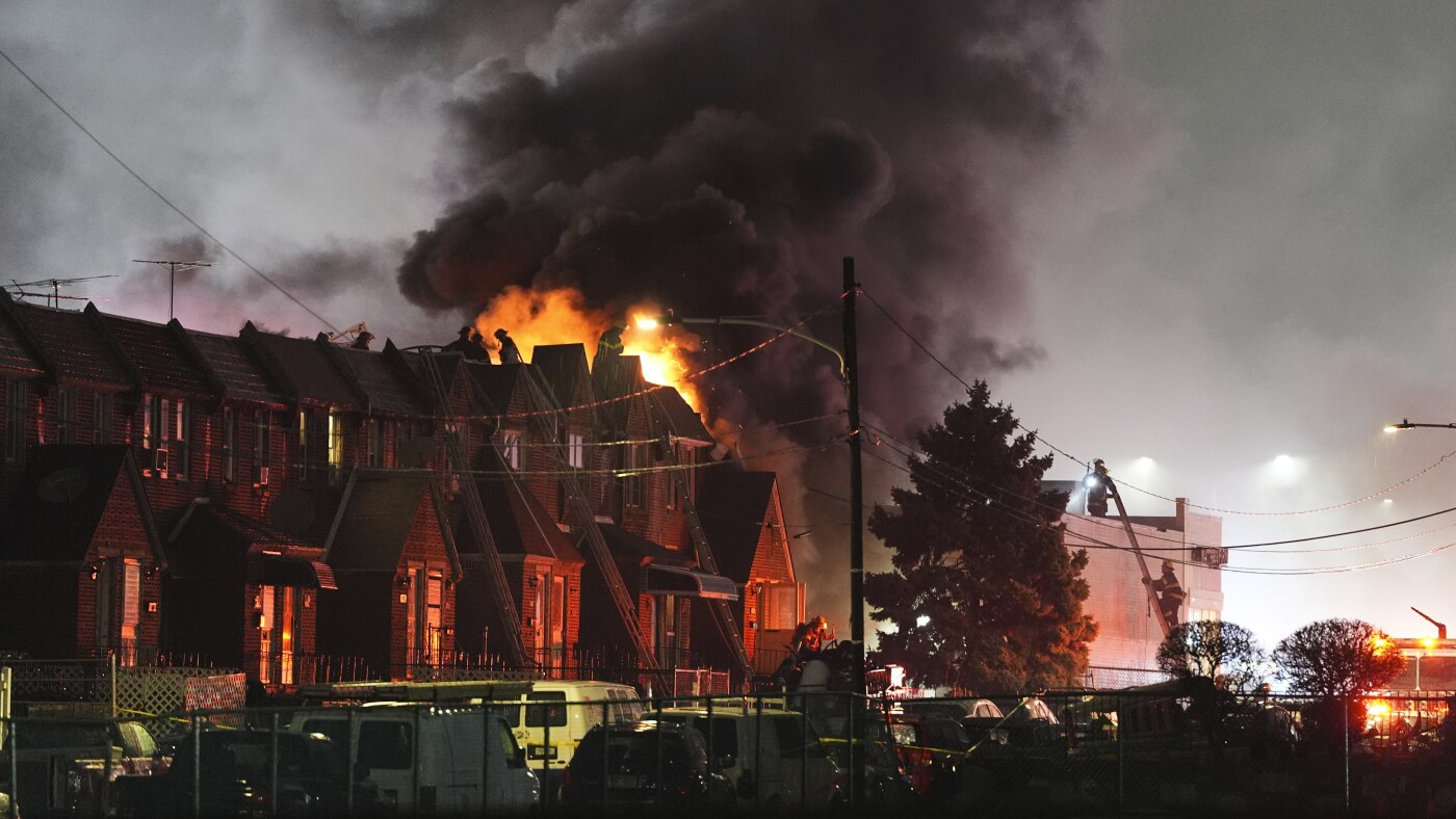 Plane with 2 aboard crashes in Philadelphia and sets multiple homes ablaze : NPR