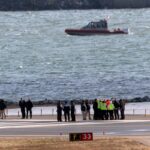 Recovery crews return to the Potomac debris after the deadly