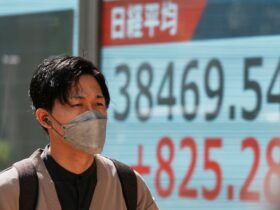 Asian shares gain after Wall Street's rally, but hopes are tempered by trade war uncertainties