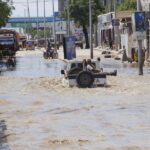 At least seven people die as heavy rains leave waist-high floodwaters in Somalia's capital