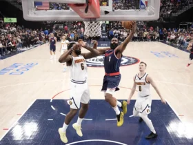 LA Clippers guard James Harden (1) shoots the ball against Denver Nuggets center DeAndre Jordan (6) and guard Christian Braun (0) in the first half during game six of first round for the 2025 NBA Playoffs at Intuit Dome. Mandatory Credit: Kirby Lee-Imagn Images