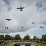 COLLEVILLE-SUR-MER, FRANCE - JUNE 06: US Military aircraft perform a flyover during a ceremony to mark the 81st anniversary of the D-Day landings during World War II at the Normandy American Cemetery on June 06, 2025 in Colleville-sur-Mer, France. Today marks the 81st Anniversary of