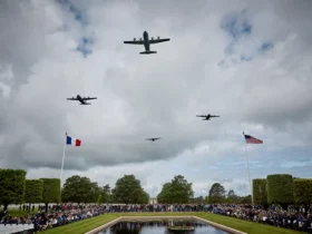 COLLEVILLE-SUR-MER, FRANCE - JUNE 06: US Military aircraft perform a flyover during a ceremony to mark the 81st anniversary of the D-Day landings during World War II at the Normandy American Cemetery on June 06, 2025 in Colleville-sur-Mer, France. Today marks the 81st Anniversary of