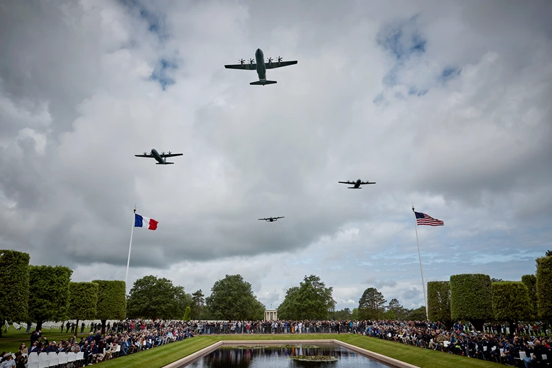 COLLEVILLE-SUR-MER, FRANCE - JUNE 06: US Military aircraft perform a flyover during a ceremony to mark the 81st anniversary of the D-Day landings during World War II at the Normandy American Cemetery on June 06, 2025 in Colleville-sur-Mer, France. Today marks the 81st Anniversary of