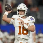 Texas quarterback Arch Manning (16) works out during the Cotton Bowl College Football Playoff semifinal game against between Texas and Ohio State, Friday, Jan. 10, 2025, in Arlington, Texas.