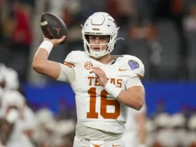 Texas quarterback Arch Manning (16) works out during the Cotton Bowl College Football Playoff semifinal game against between Texas and Ohio State, Friday, Jan. 10, 2025, in Arlington, Texas.