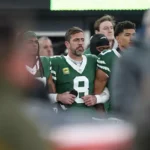 New York Jets quarterback Aaron Rodgers (8) stands with teammates during the national anthem before the game against the Miami Dolphins at MetLife Stadium. Vincent Carchietta-Imagn Images/ File Photo