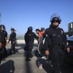 LA police make arrests as curfew goes into effect
