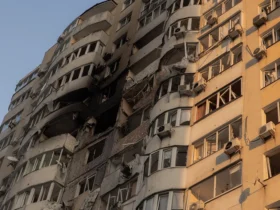 A man looks out from a burned apartment in a residential building damaged during a Russian air strike in Kyiv on June 6, 2025, amid the Russian invasion of Ukraine. Russia carried out a barrage of drone strikes across Ukraine overnight, killing at least four people and wounding 20 in the capital Kyiv, Ukrainian officials said on June 6. (Photo by Roman PILIPEY / AFP) (Photo by ROMAN PILIPEY/AFP via Getty Images)