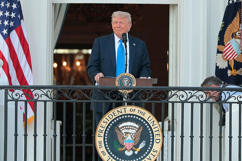 WASHINGTON, DC - JUNE 04: U.S. President Donald Trump speaks to guests from the South Portico of the White House during an event on the South Lawn on June 04, 2025 in Washington, DC. Trump held the “Summer Soirée” for guests, including staff, cabinet members, and supporters to visit the grounds and enjoy the recent onset of summer heat. (Photo by Anna Moneymaker/Getty Images)